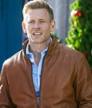 A Christmas Less Traveled Eric Johnson Brown Leather Jacket close up view