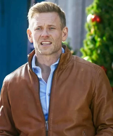 A Christmas Less Traveled Eric Johnson Brown Leather Jacket close up view