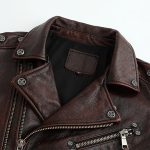 Closeup of the Mens Graphite Distressed Multi-Zipper Leather Biker Jacket focusing on the distressed leather and zipper details.