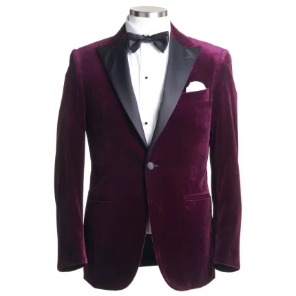 Front view of a maroon velvet coat with black lapels and bow tie
