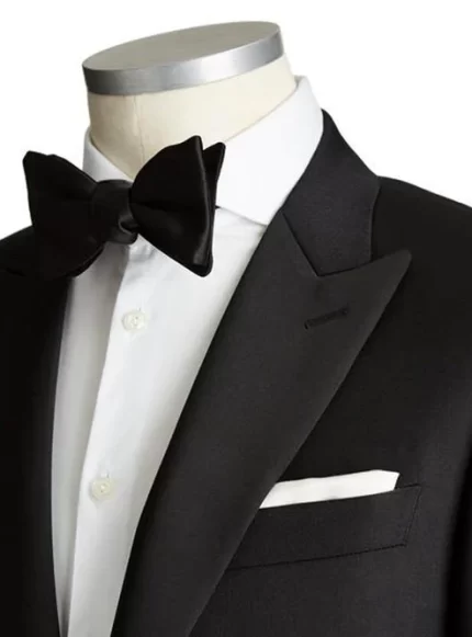 Closeup of a black tuxedo focusing on the bow tie and lapel details